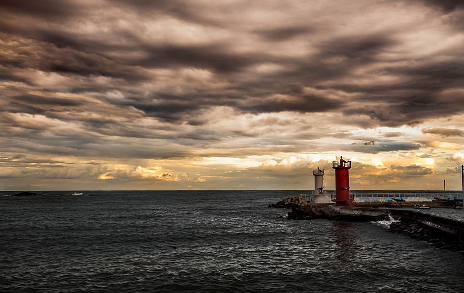 sea, waves, lighthouse, the evening, cloud, cloud - sky, water HD wallpaper