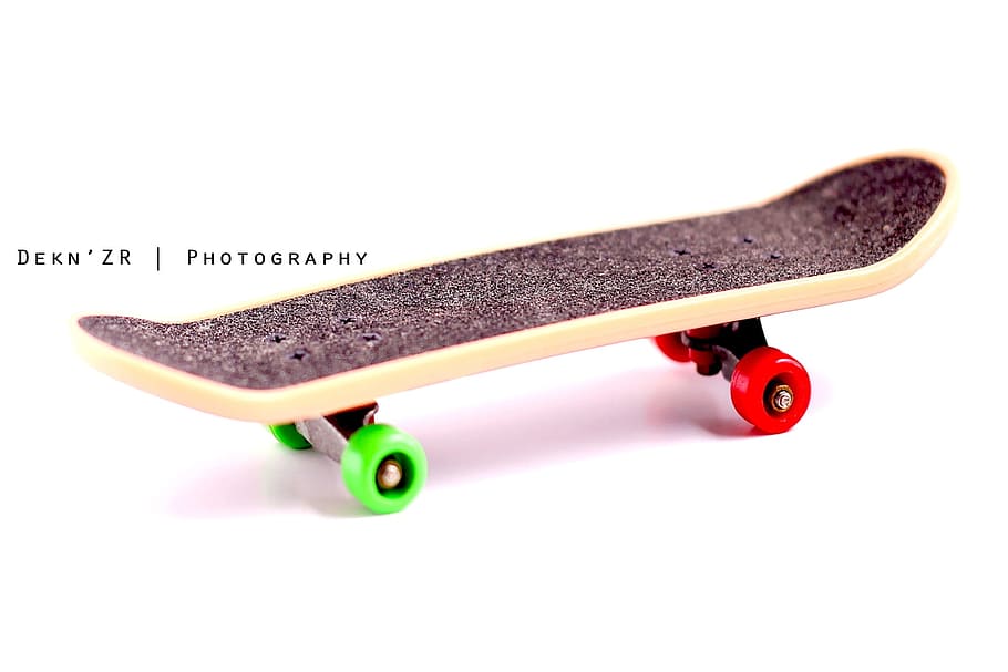 black and beige skateboard on white surface, Sports Equipment