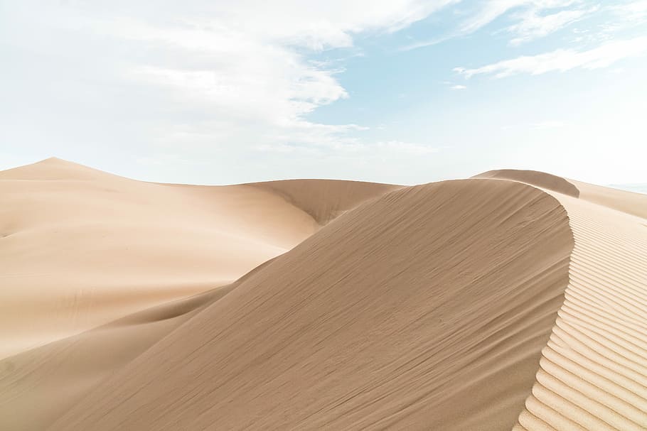 landscape photography of desert, sand hills under white clouds HD wallpaper