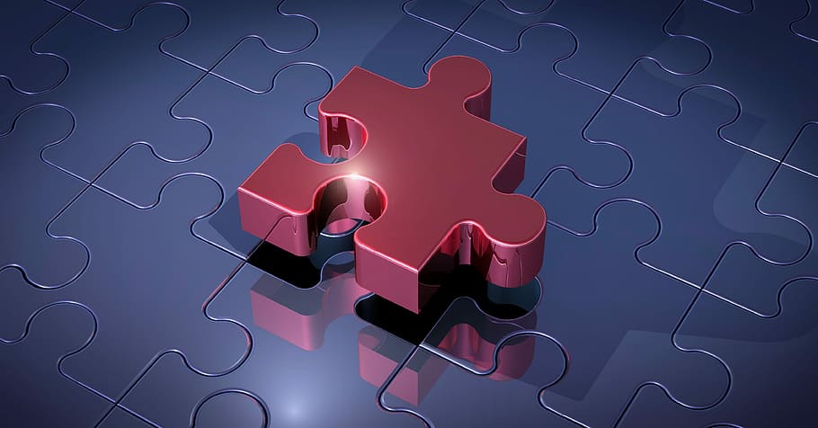 red puzzle on gray surface, pieces of the puzzle, connection