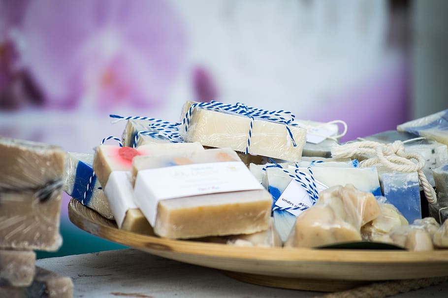 selective focus photography of soap party favors, soap bars on brown wooden plate HD wallpaper