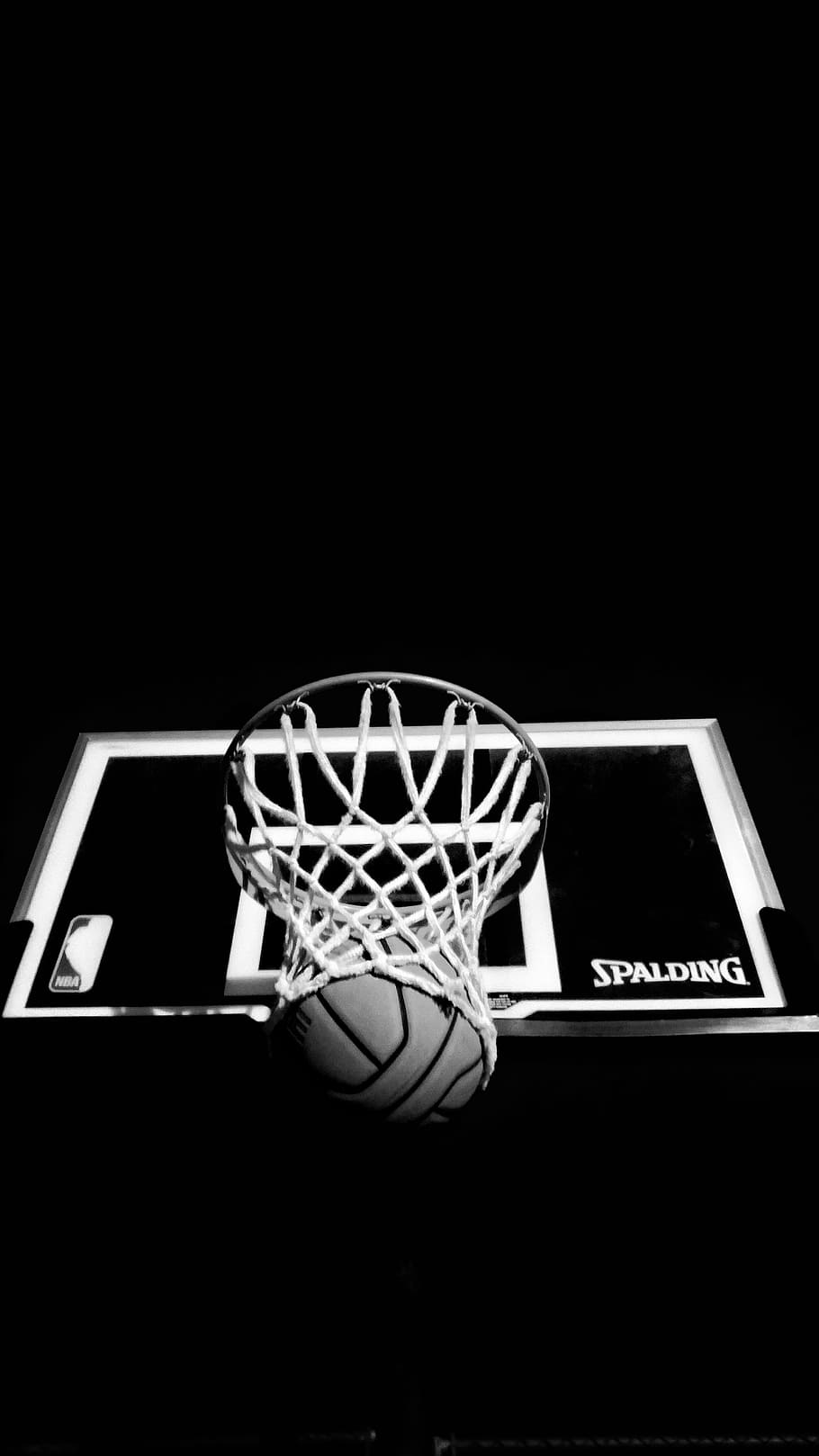 grayscale photography of Spalding basketball hoop and ball, photograpy