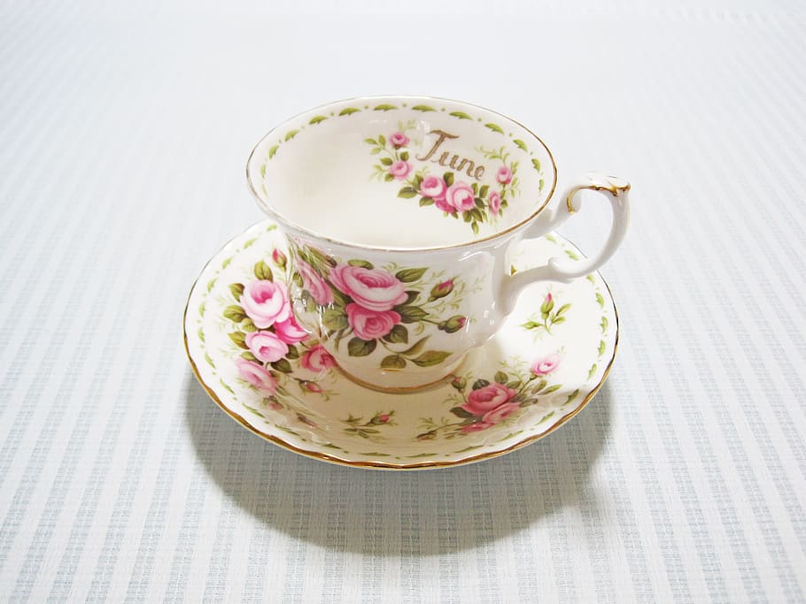 white-pink-and-green floral ceramic cup and saucer on whtie textile HD wallpaper