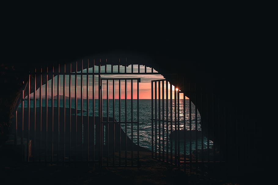 opened gate near body of water, silhouette of gate near body of water HD wallpaper