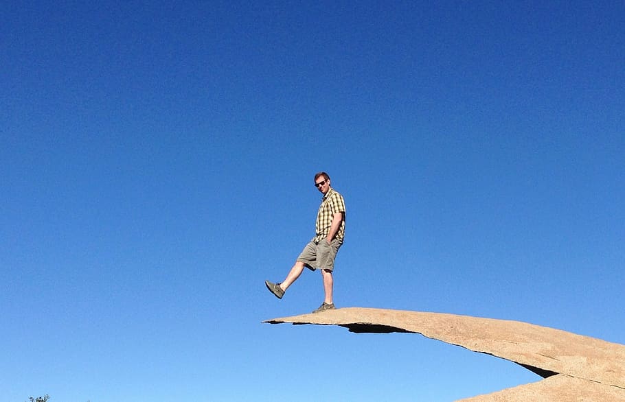 man, balancing, cool, mountain, hiking, chip rock, bird, animal HD wallpaper