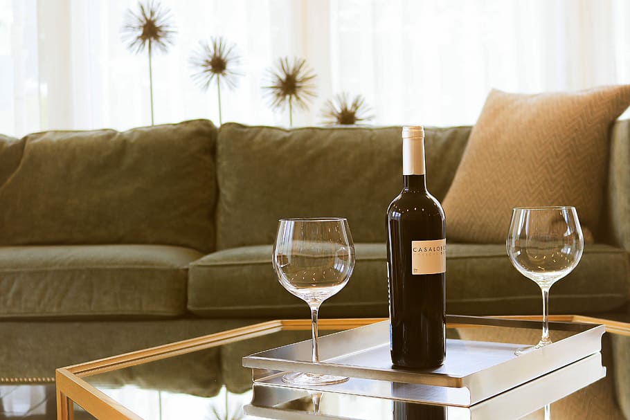 black wine bottle beside two wine glasses, wine bottle and two wine glasses on table inside room, HD wallpaper
