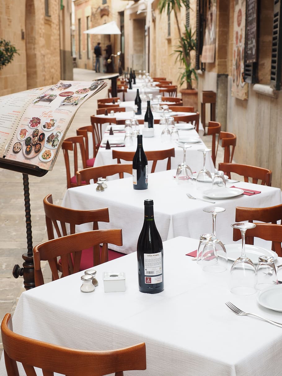 lined tables and chairs beside house during daytime, restaurant HD wallpaper