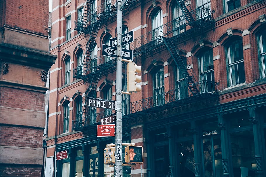 street signage in middle of buildings, signs, one way, intersection HD wallpaper