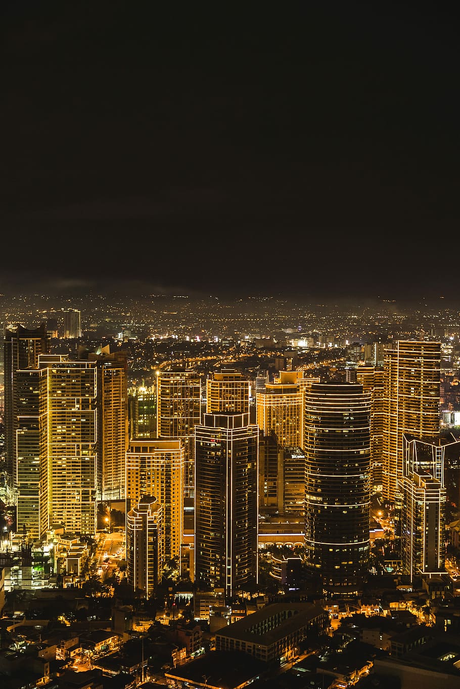 city buildings during night time, aerial photography of high-rise buildings HD wallpaper