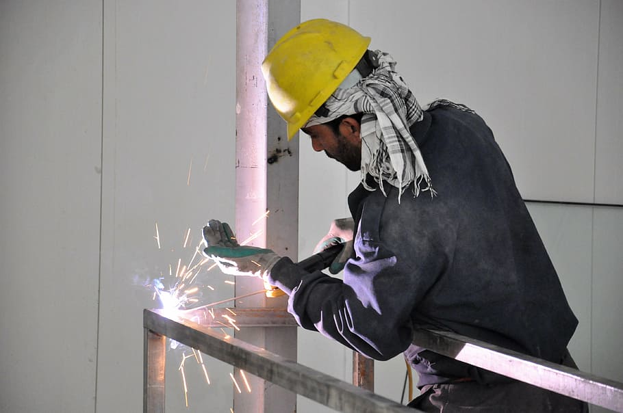 man constructing metal frame with welding machine, workers, welder, HD wallpaper