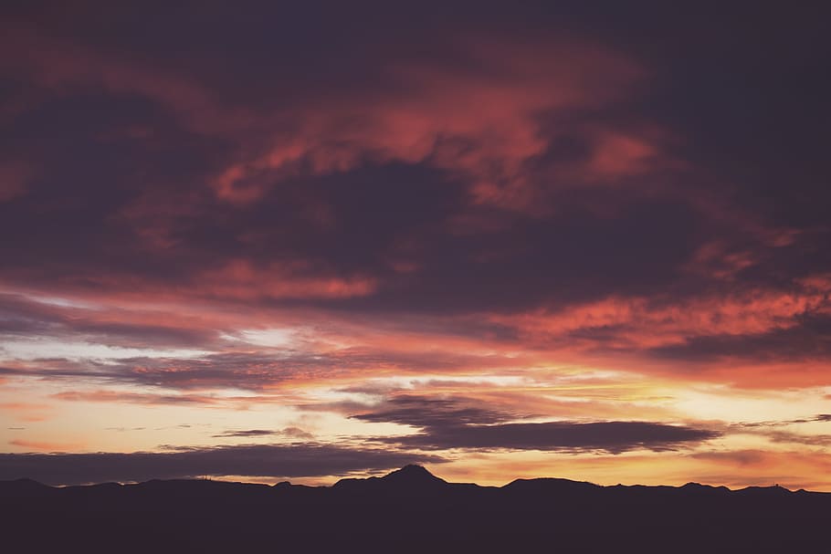 silhouette photo of mountain during golden hour, clouds during dusk HD wallpaper