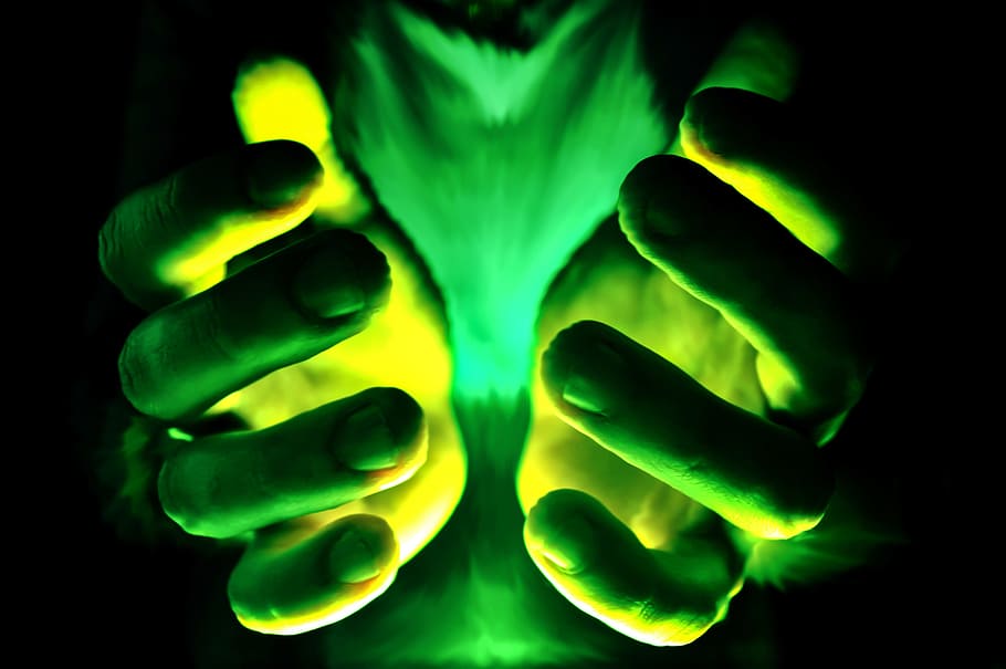 selective color photography of person's hand with green lights HD wallpaper