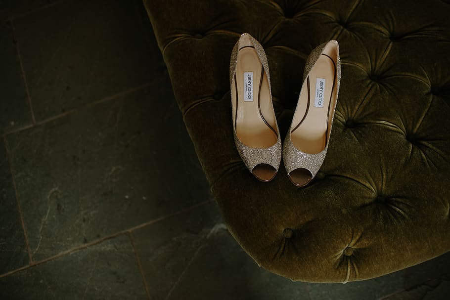 pair of brown gray leather open-toe heeled shoes on tufted mattress, pair of women's beige peep-toe leather shoes HD wallpaper