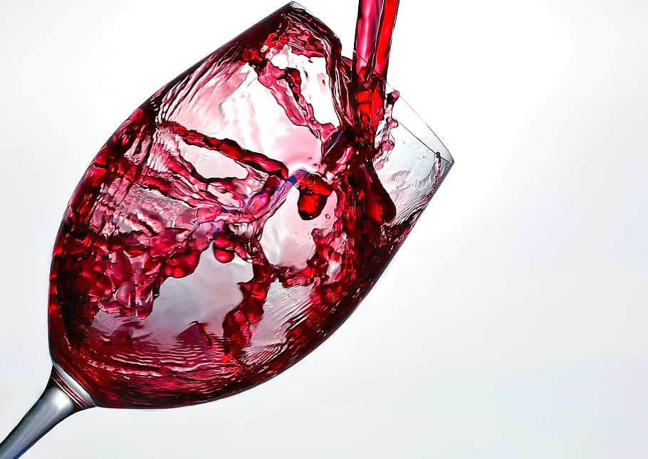 clear wine glass with red liquid, wine bottle, red wine, splash