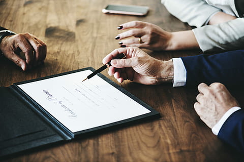 man holding pen while trying to sign a document, settlement HD wallpaper