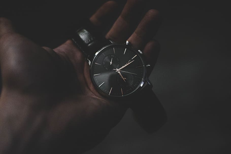 person holding watch pointing at 6:17, person holding chronograph watch at 6:16 HD wallpaper