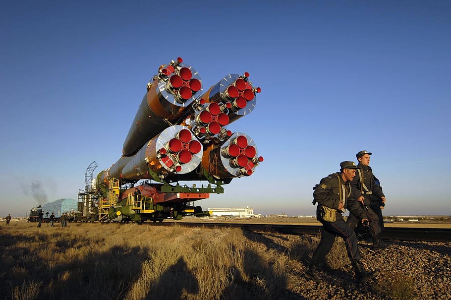 two man walking in distance rocket, kazakhstan, soyuz, space HD wallpaper