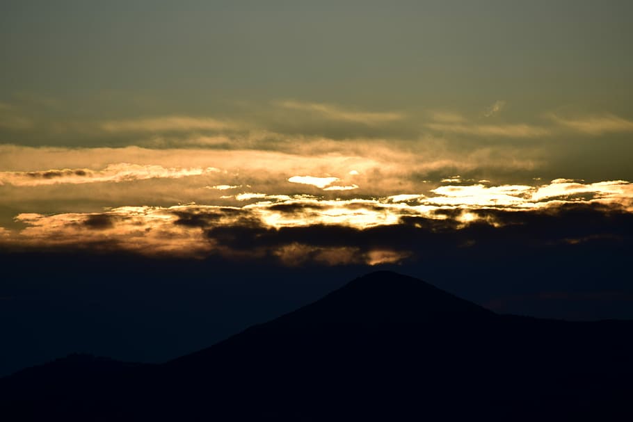photo of mountains during sunset, silhouette photo of clouds HD wallpaper