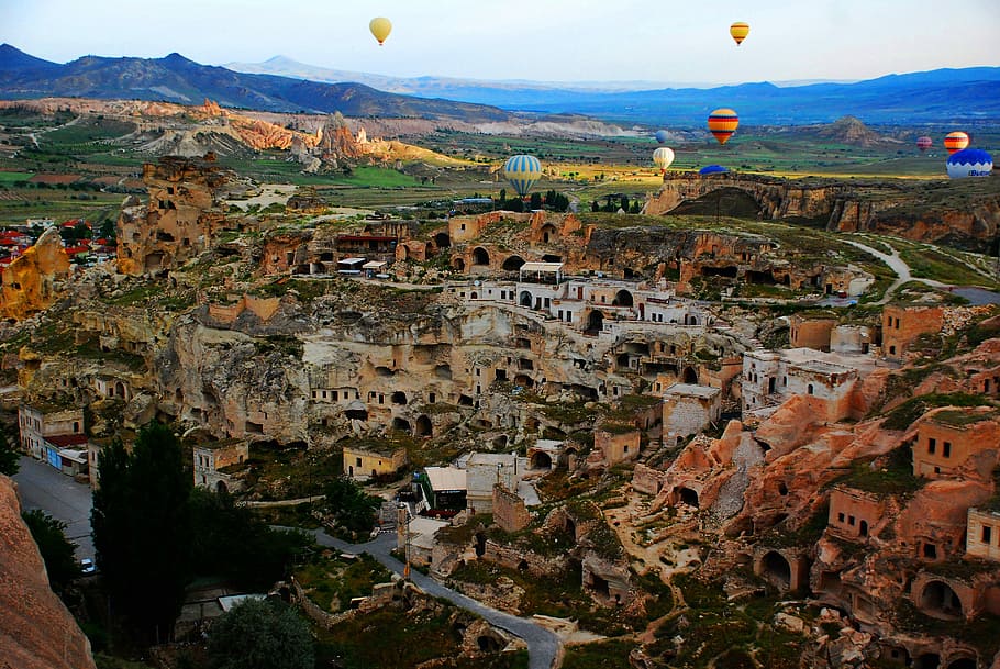hot-air balloons over city ruins, cityscape, baloon, cappadocia