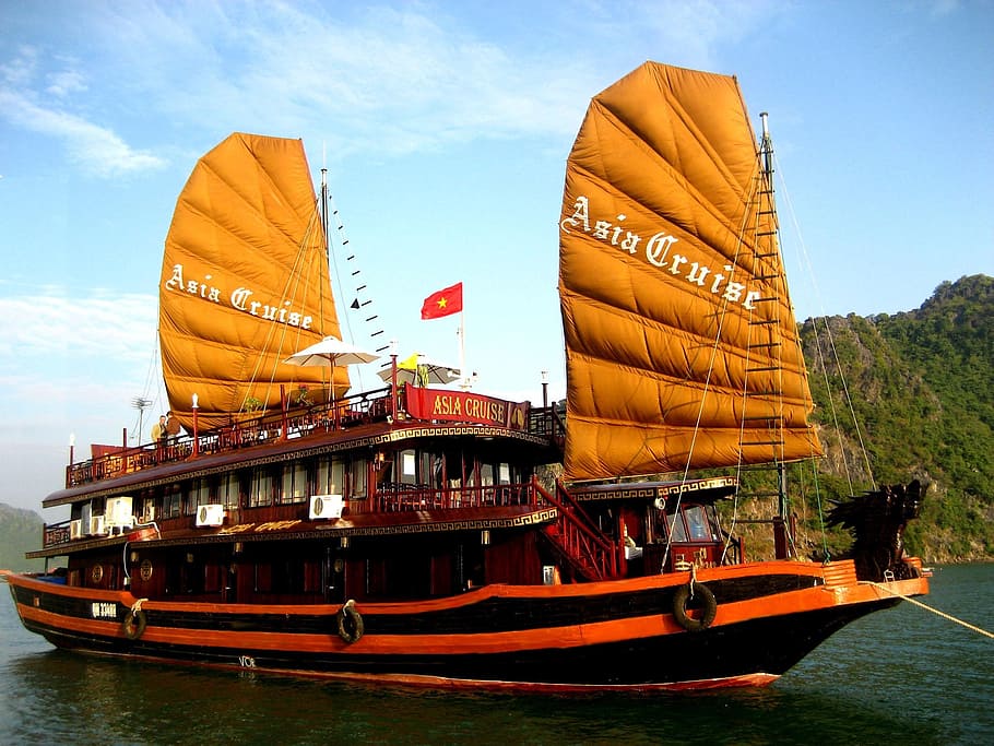 orange and black Asia Cruise ship, vietnamese ship, halong bay