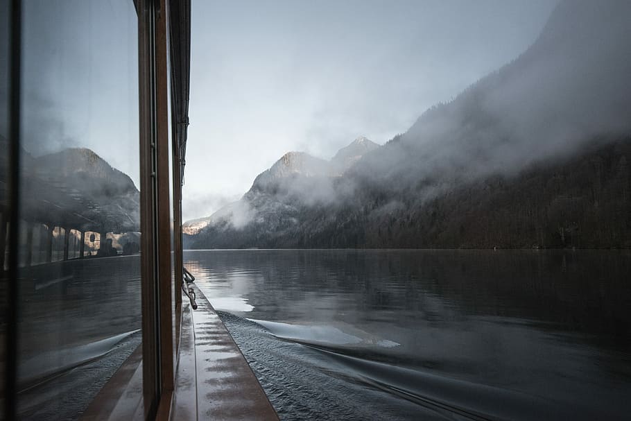 rocky mountain with fog, time lapse photography of boat near mountain HD wallpaper