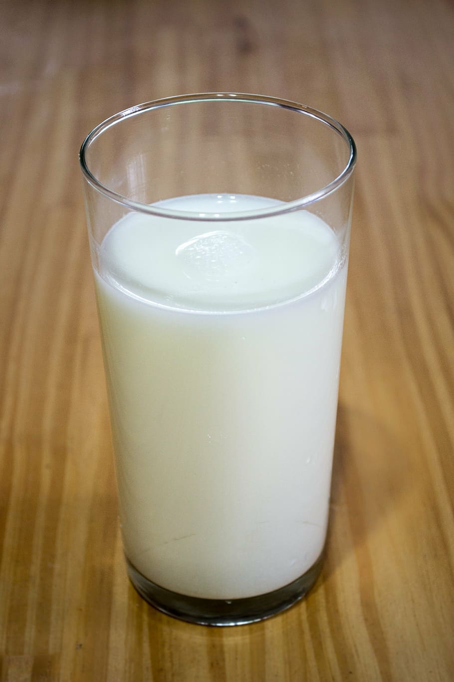 milk in clear glass on table, glass of milk, calcium, nutrition