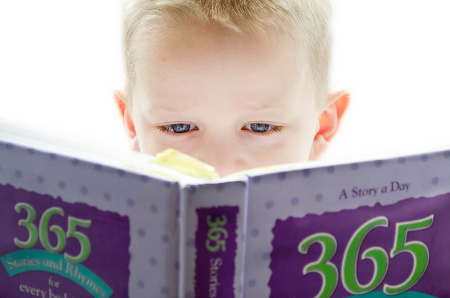 boy holding a 365 story book, learning, development, looking HD wallpaper