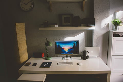 silver iMac and white cordless keyboard on white wooden table inside room, gray flat screen monitor and white wireless keyboard on computer table HD wallpaper