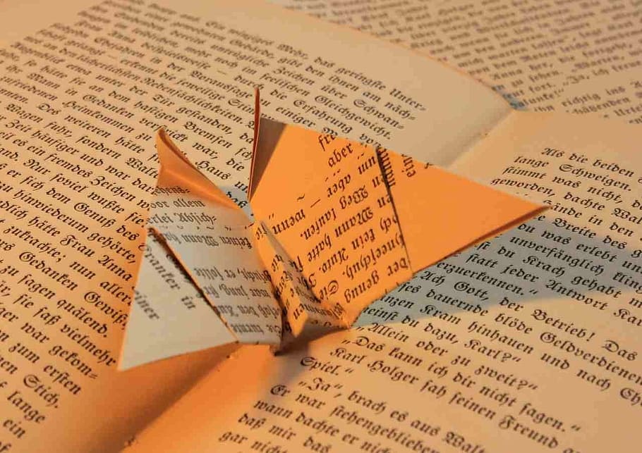 paper origami on book, folded, book page, law, human body part, HD wallpaper