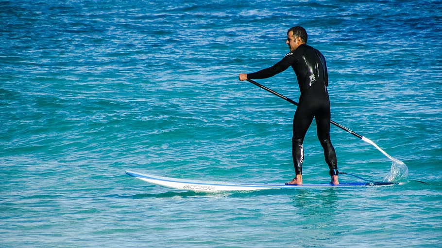 man using paddle board on body of water, paddleboarding, sport, HD wallpaper