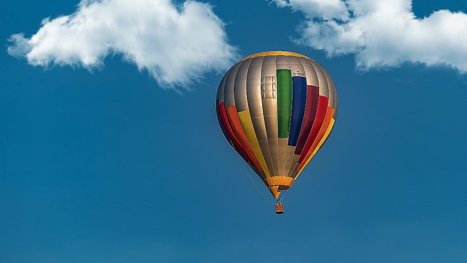 photography of multicolored hot air balloon under blue sky HD wallpaper