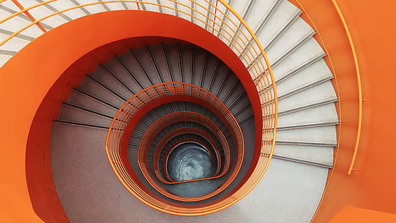 empty spiral stairs on low-angle photograph, aerial view of spiral stair HD wallpaper