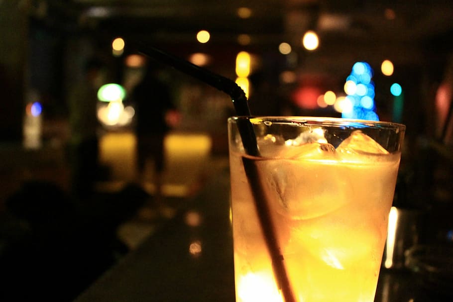 yellow liquid in cup with straw, cocktail, bar, night, glass HD wallpaper