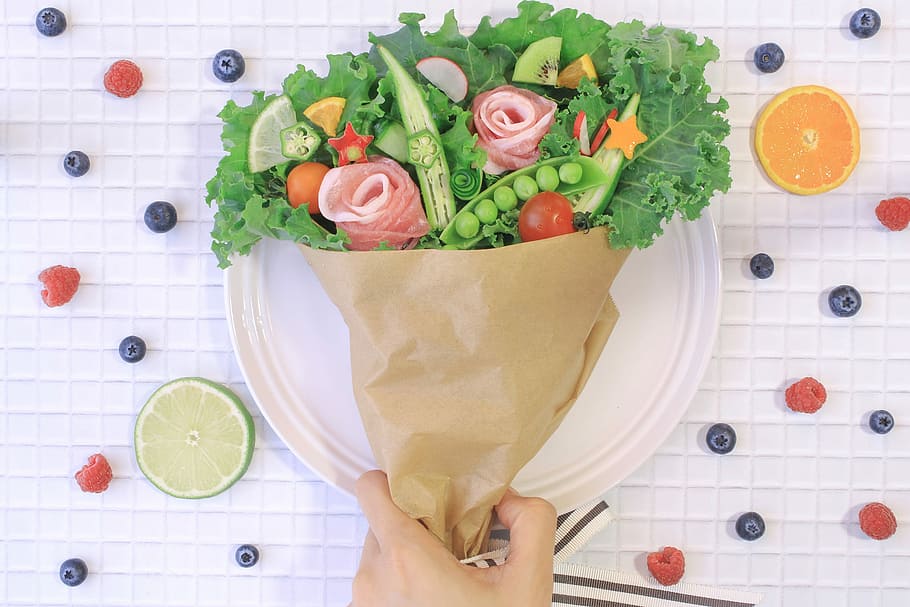 person holding assorted vegetables and flowers on paper cone HD wallpaper