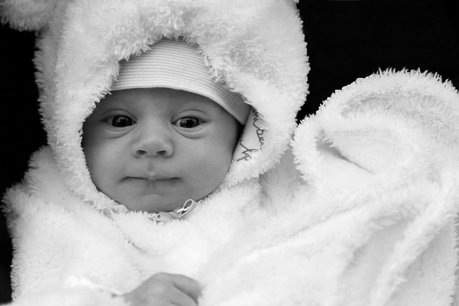 grayscale photo of baby wearing white comforter, cap, care, caucasian