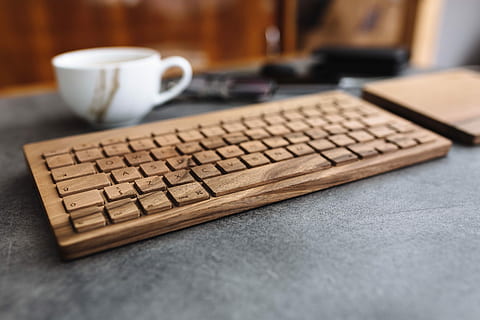 Young man typing on the wooden keyboard, workspace, workplace HD wallpaper
