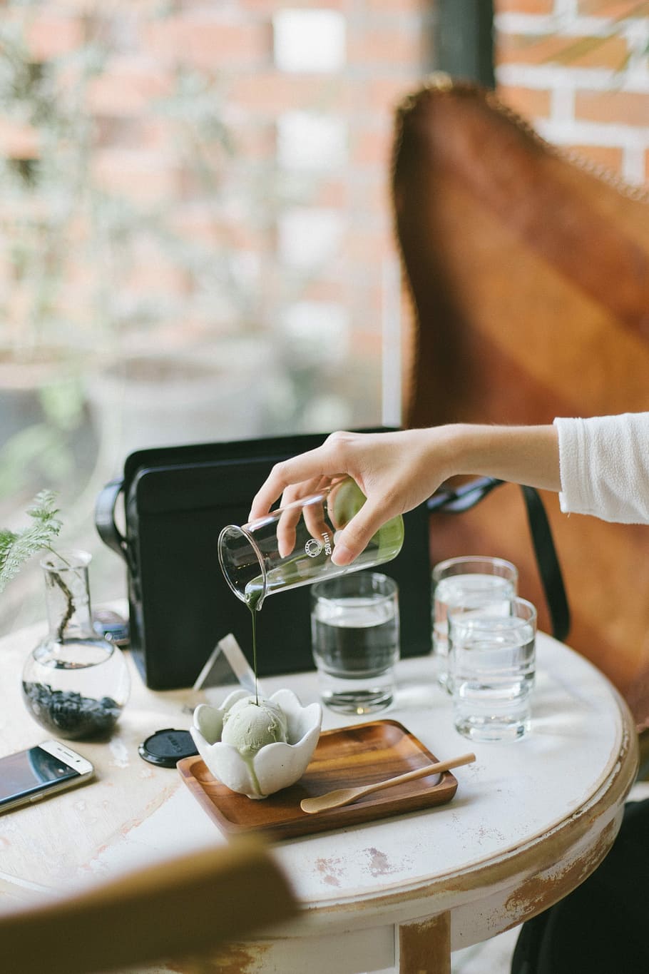 person pouring liquid from clear glass pitcher, women, people HD wallpaper