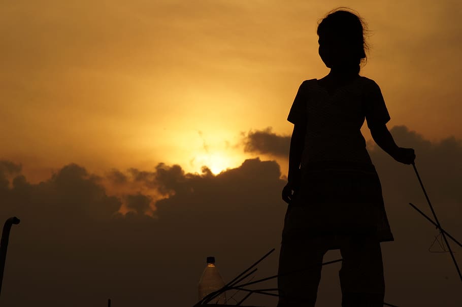 silhouette of woman standing during orange sunset, yellow, sunrise HD wallpaper
