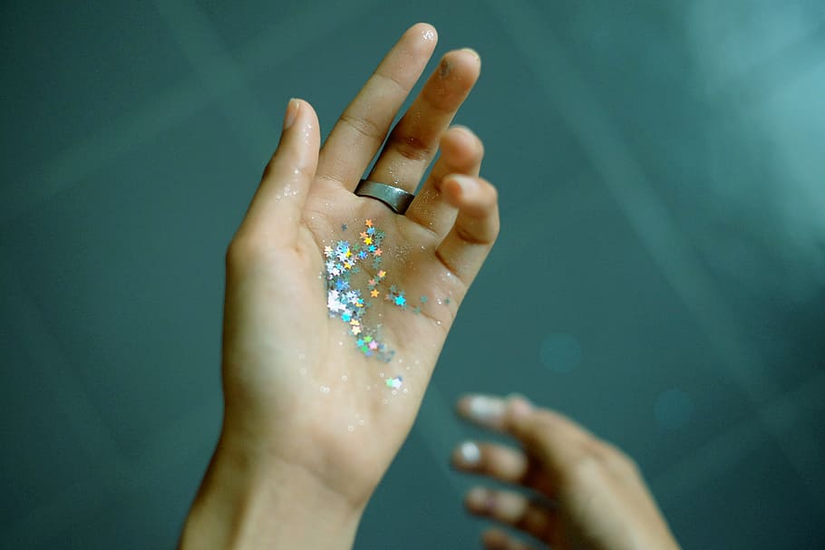 person showing hands with glitters, person showing assorted color glitters HD wallpaper