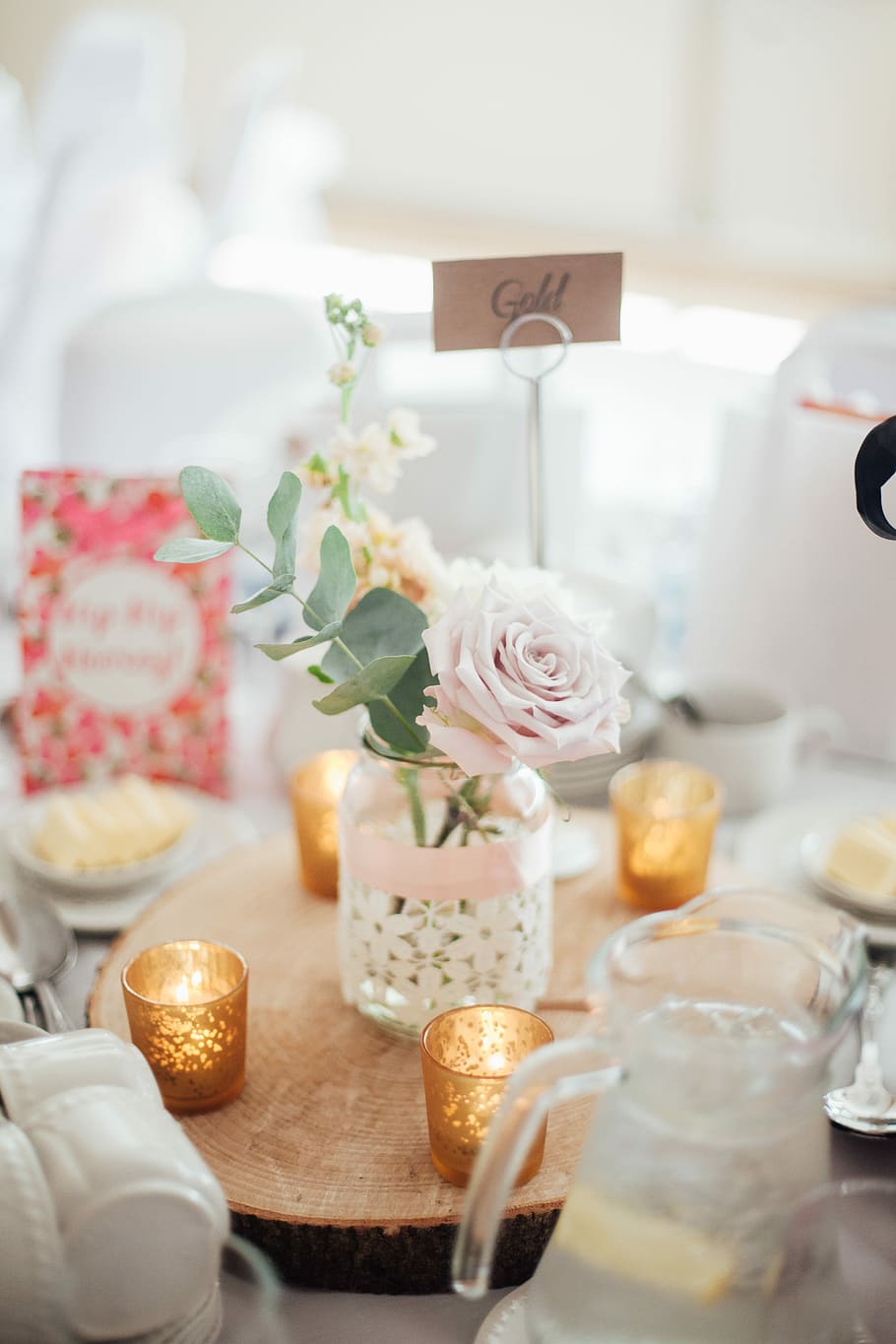 pink rose flower with glass pot centerpiece, pink rose flower in clear glass jar beside tealight candles HD wallpaper