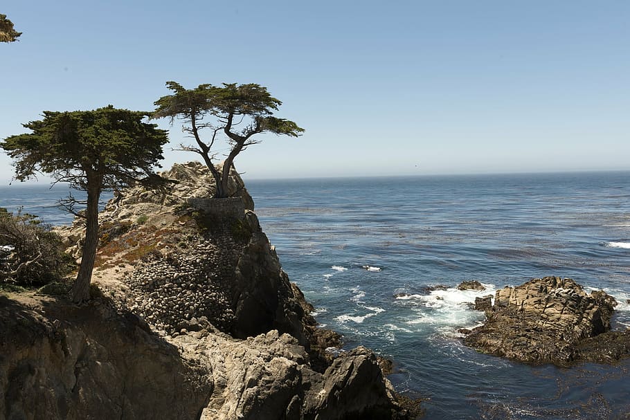 aerial photography of rock formation near sea at daytime, pebble beach, HD wallpaper