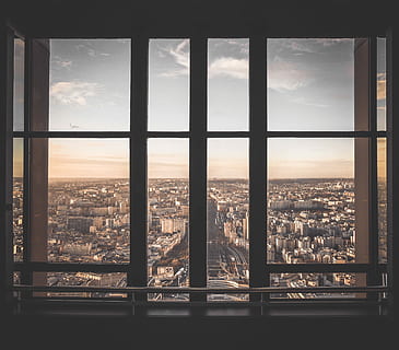 glass panel window showing city buildings under blue sky, view of city inside building with glass window HD wallpaper