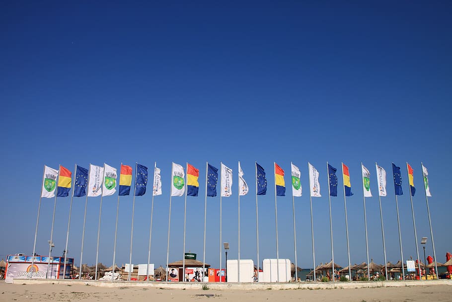 beach, colored, country, flags, neptune, romania, sunny, wind HD wallpaper