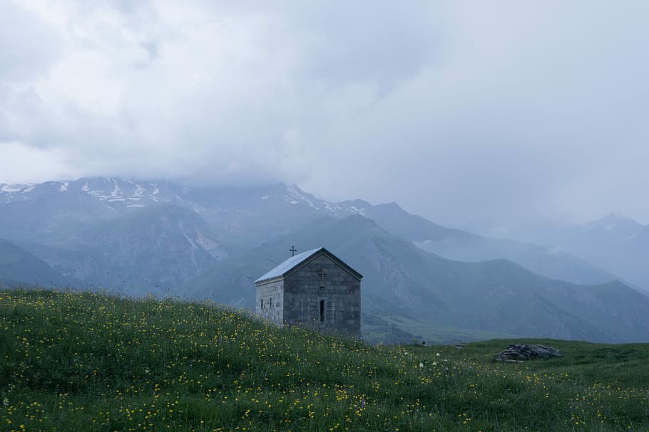 gray house near green grasses, Ioane Natlismcemeli Church in Kazbegi, Georgia, HD wallpaper