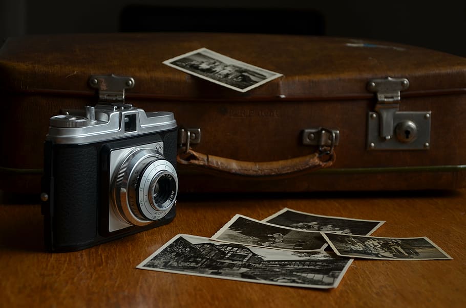 black camera in shallow focus lens, photos, photograph, paper prints