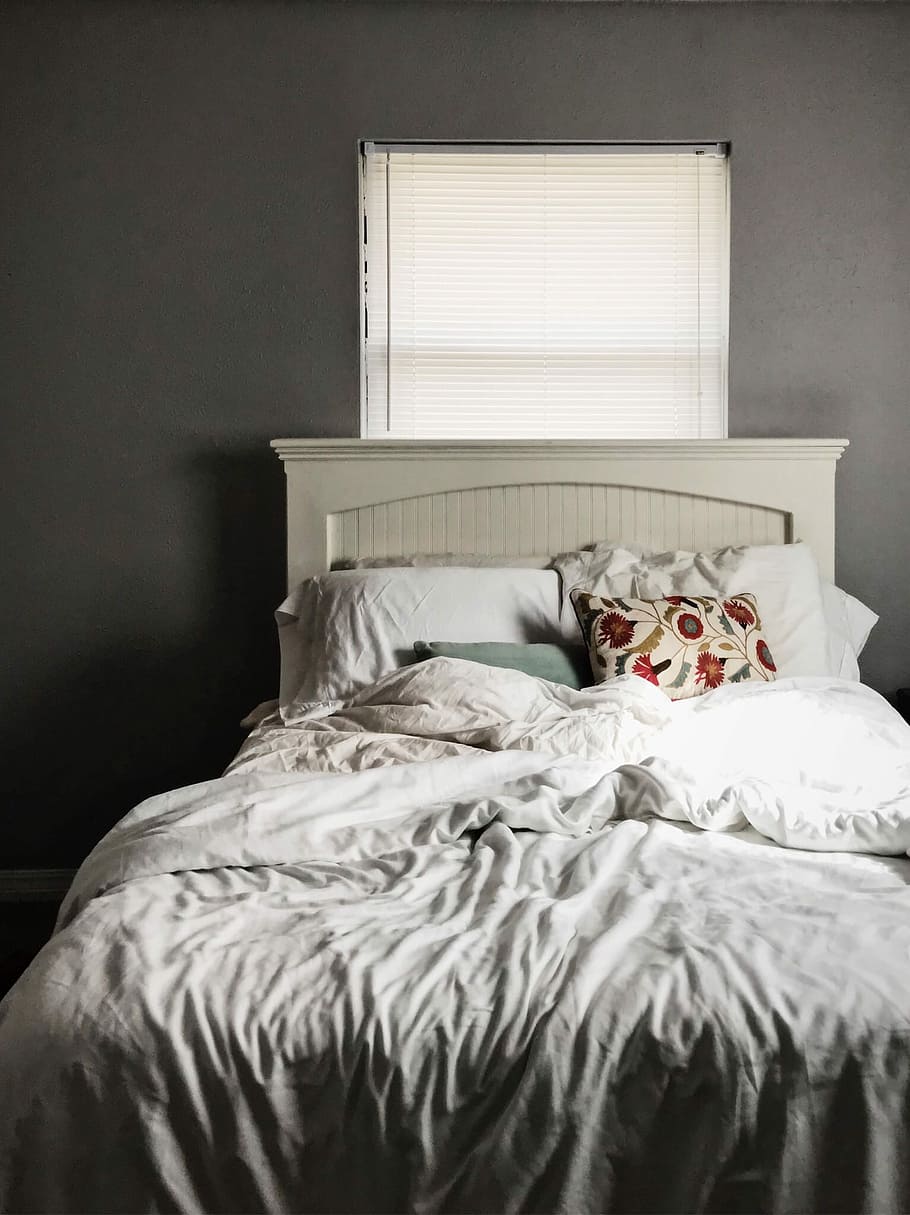 white and gray bed sheet with pillow on bed, white bed comforter on white wooden bed HD wallpaper