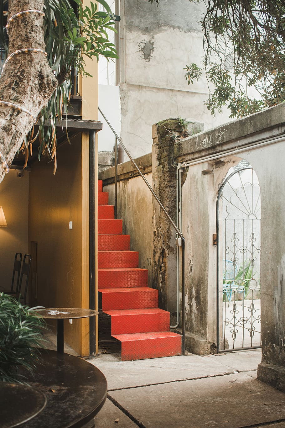 red metal stair beside building, photo of opened stormgate door HD wallpaper
