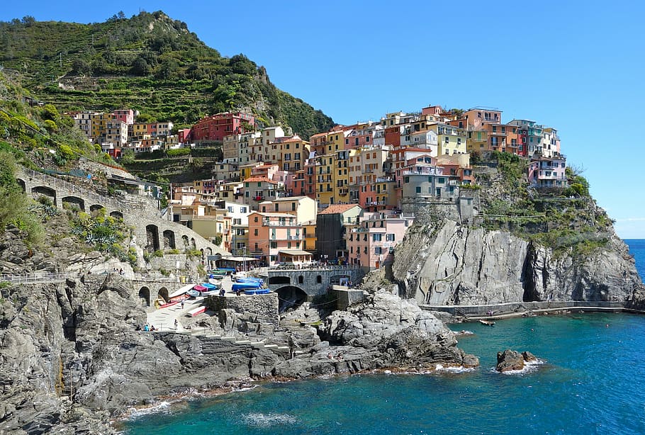 assorted-color concrete houses during daytime, italy, manarola