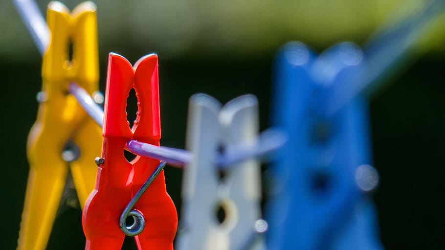 macrophotograph of red, blue, white, and yellow clothespin hanging on wire, HD wallpaper