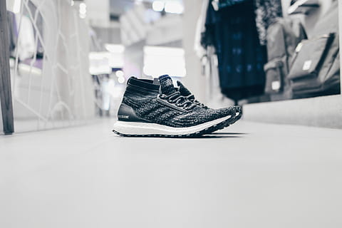 pair of ggray running shoes, pair of black-and-white sneakers on white surface HD wallpaper